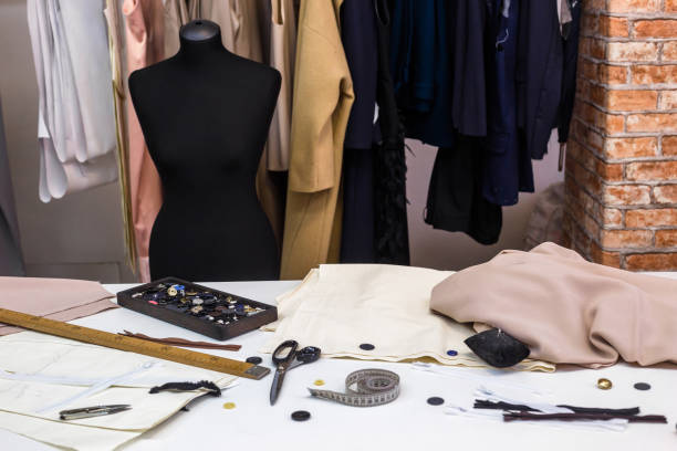 istock Design studio concept. Mannequin dummy, clothes hangers, dressmaking workplace 1281591439