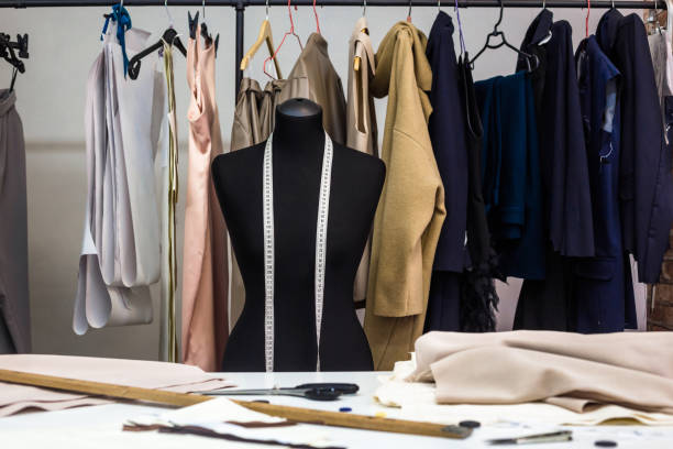 istock Design studio concept. Mannequin dummy, clothes hangers, dressmaking workplace 1281591450