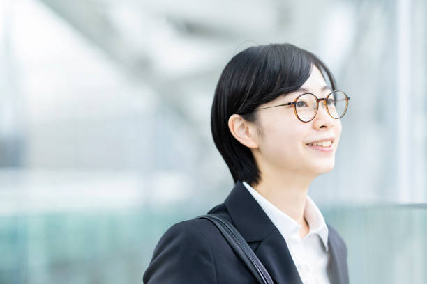 istock A young woman smiling in a suit 1281591502