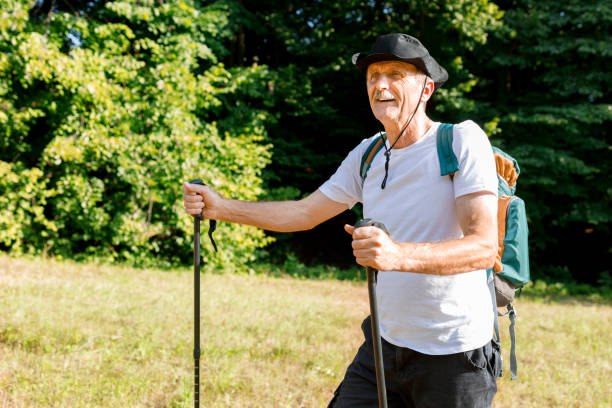 istock Elderly man hiking and using trail trekking poles 1281596701