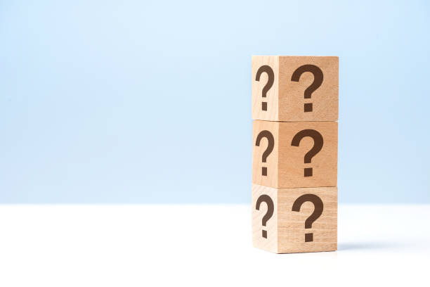 istock Wooden cube block shape with sign question mark symbol on blue background 1281600632