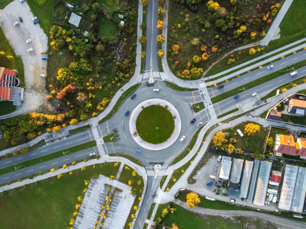 istock autumn roundabout with traffic top aerial drone view 1281602332