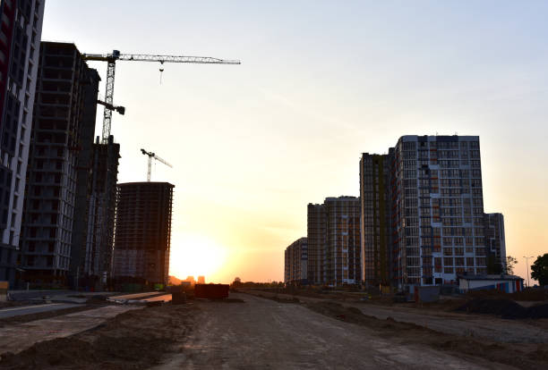 istock View on the large construction site with tower cranes and buildings on sunset background 1281604922