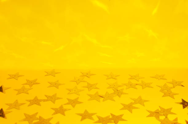 istock Template for greeting card.Shiny stars on the bright yellow background 1281606399