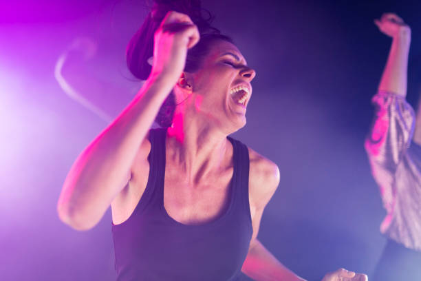 istock Woman dancing in night club 1281607494