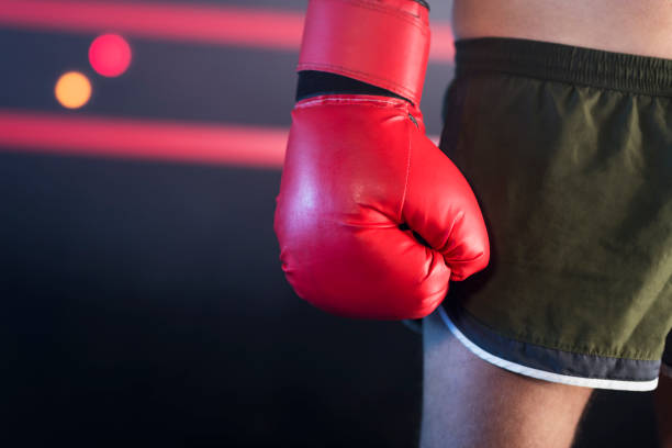 istock Man wearing boxing glove 1281607685