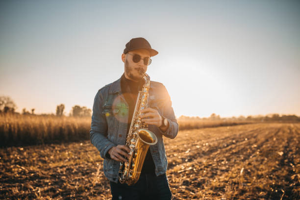 istock A handsome young musician playing a saxophone 1281607693