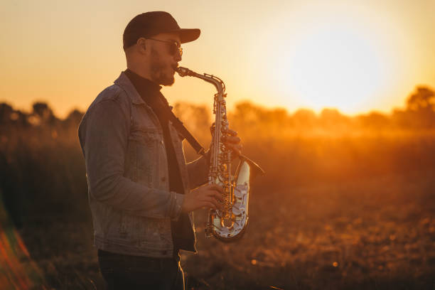 istock A handsome young musician playing a saxophone 1281607698