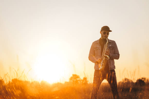 istock A handsome young musician playing a saxophone 1281607825