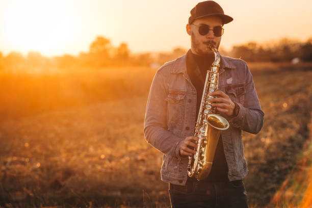 istock A handsome young musician playing a saxophone 1281607826