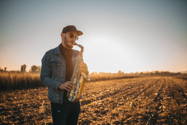 istock A handsome young musician playing a saxophone 1281607869