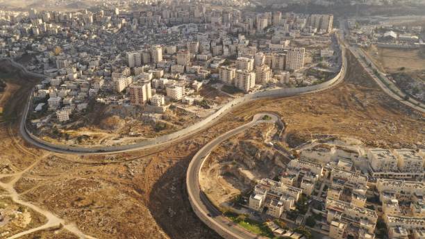 istock Israel and Palestine divided by Security wall Aerial view 1281608136