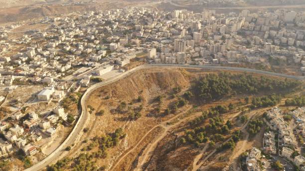 istock Israel and Palestine divided by Security wall Aerial view 1281608182
