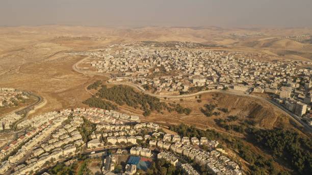 istock Israel and Palestine divided by Security wall Aerial view 1281608192
