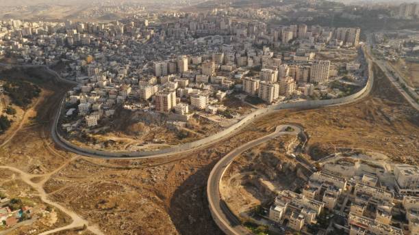istock Israel and Palestine divided by Security wall Aerial view 1281608217