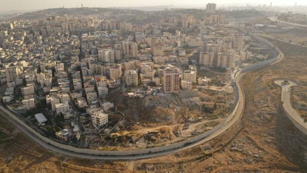 istock Israel and Palestine divided by Security wall Aerial view 1281608224