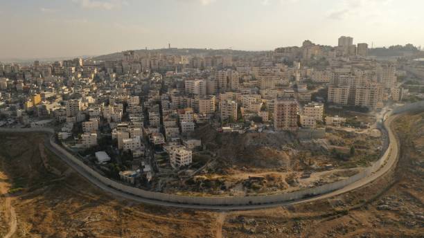 istock Israel and Palestine divided by Security wall Aerial view 1281608260