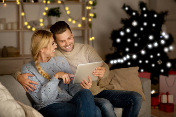 istock Loving couple having fun together at home on xmas 1281613774