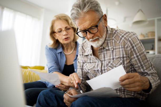 istock Senior couple having problems with home finances 1281613816