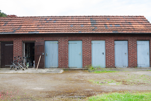 Row of old sheds and walkers in Oberhausen in Ruhrgebiet