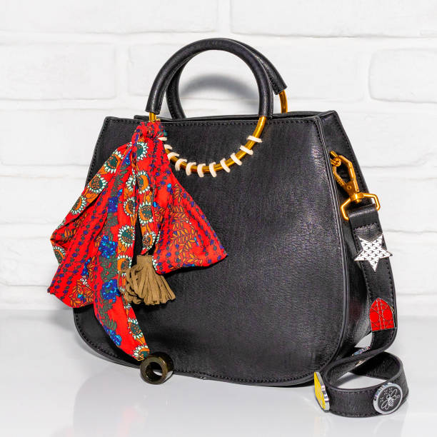 istock Black female bag with scarf 1281619254