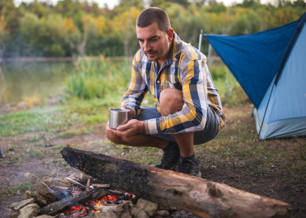 istock Lonely man camper next to a bonfire 1281620655
