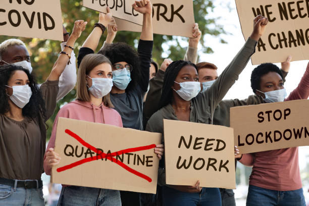 istock International group of people in face masks protesting against quarantine 1281622288