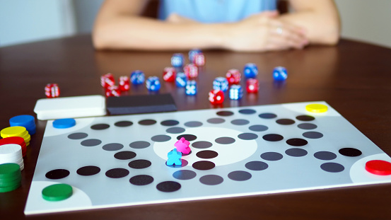 woman people playing fun board game on wooden table top selected focus