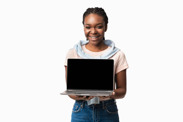 istock Black Woman Holding Laptop With Empty Screen On White Background 1281623584