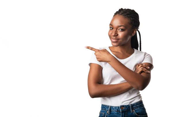 istock Young Black Lady Pointing Finger Aside Standing On White Background 1281623842