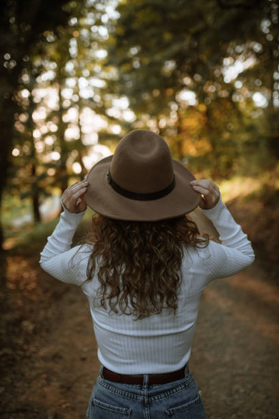 istock Rear view of a young woman using a hat 1281623943