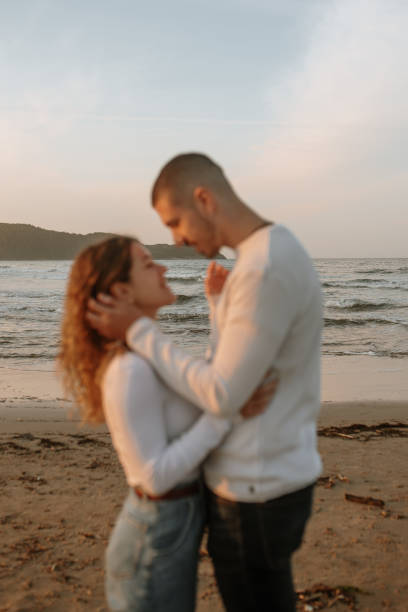 istock Young couple at the beach 1281625553