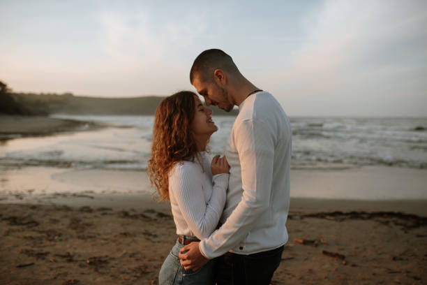 istock Young couple at the beach 1281625585