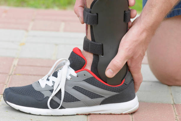 istock Man wearing ankle brace 1281625827