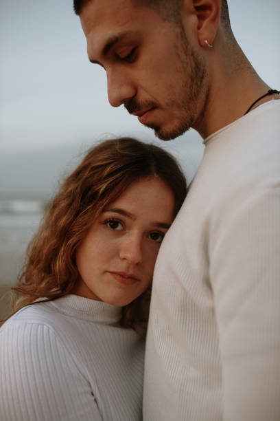 istock Young couple at the beach at sunset 1281627478