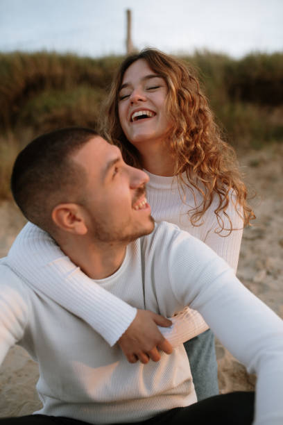 istock Young couple at the beach 1281627588