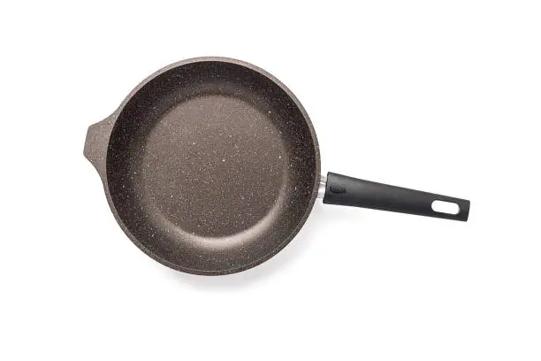 New black frying pan on a white background, with non-stick coating