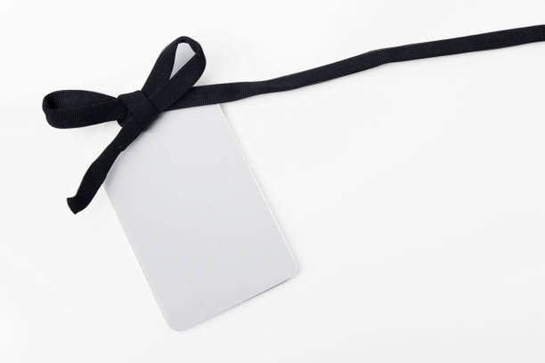 istock White label tag with black ribbon 1281629266