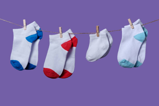 istock Premature baby day concept. Tiny socks 1281630634