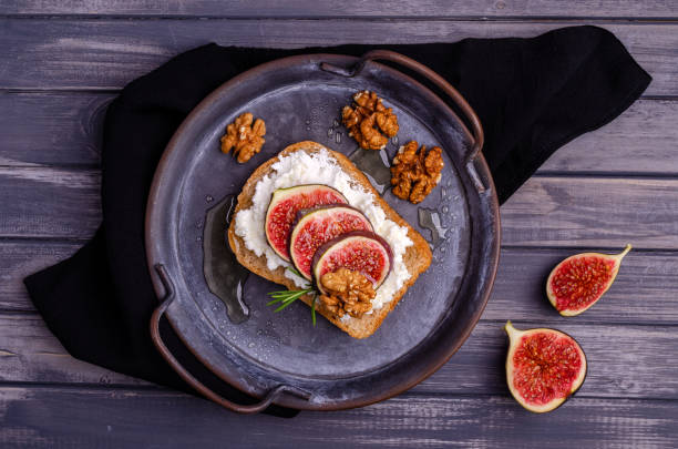 istock Sandwich with white cream, figs and honey 1281633145