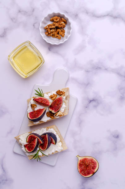 istock Sandwich with white cream, figs and honey 1281633204