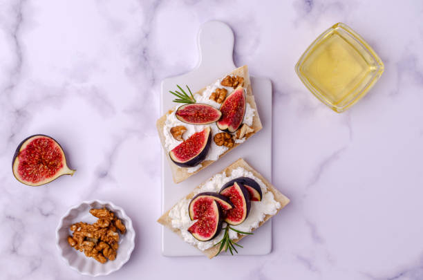 istock Sandwich with white cream, figs and honey 1281633252
