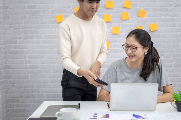 istock Two office workers work at home in casual clothes during COVID infection prevention. 1281634219