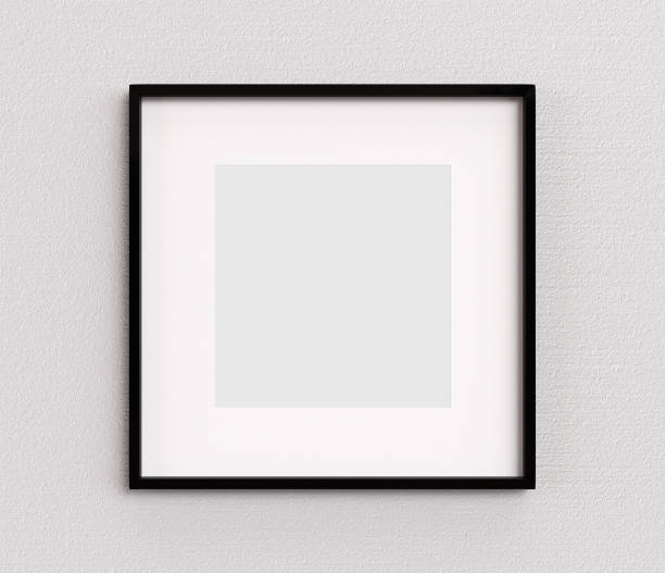 Black picture frame square shape on white wall. Blank Mockup stock photo