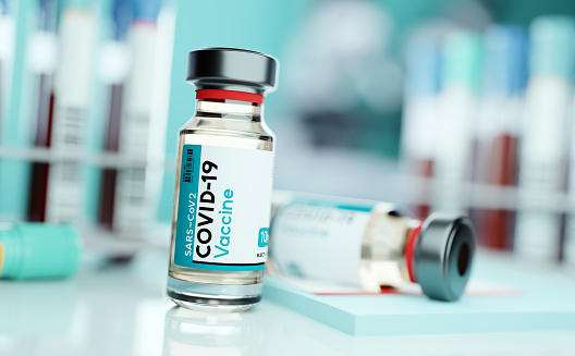 A vial of SARS-CoV2 COVID-19 vaccine in a medical research and development laboratory. Science 3D illustration.