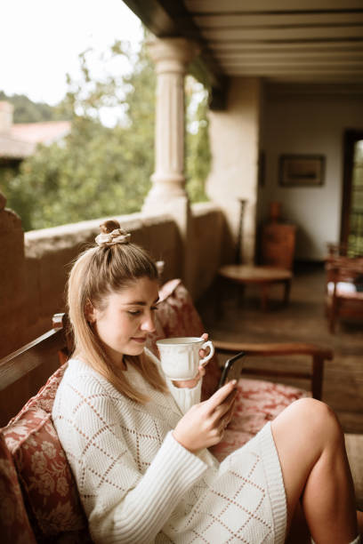 istock Young woman using a smart phone at home 1281636103