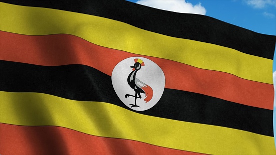 Uganda flag waving in the wind, blue sky background. 3d rendering.