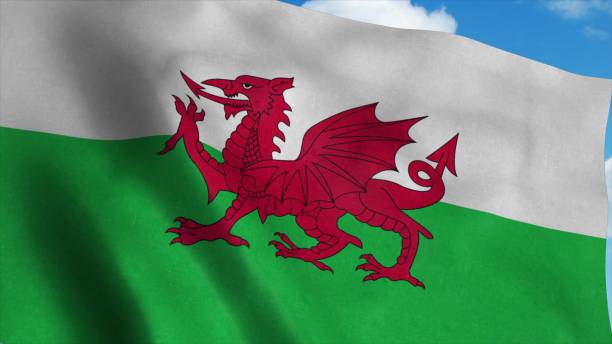 istock Wales flag waving in the wind, blue sky background. 3d rendering 1281637110