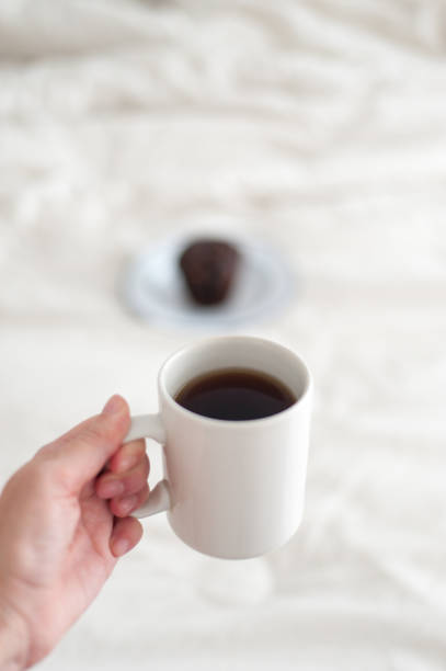 istock Coffee mug and chocolate muffin 1281639278