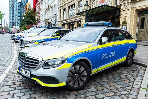 Hamburg, Germany - August 16, 2019: Mercedes police car parked on street in St. Pauli (Sankt Pauli), quarter of the city of Hamburg, Germany